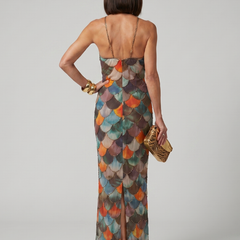 Back view of multicolor scale-pattern fitted maxi dress with halter straps