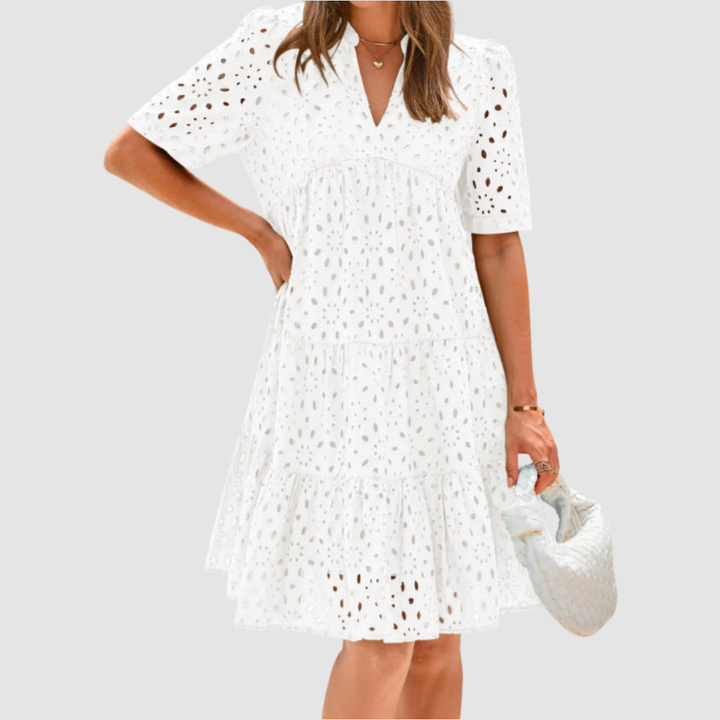 White V-neck tiered babydoll summer dress, short sleeves, dotted pattern.