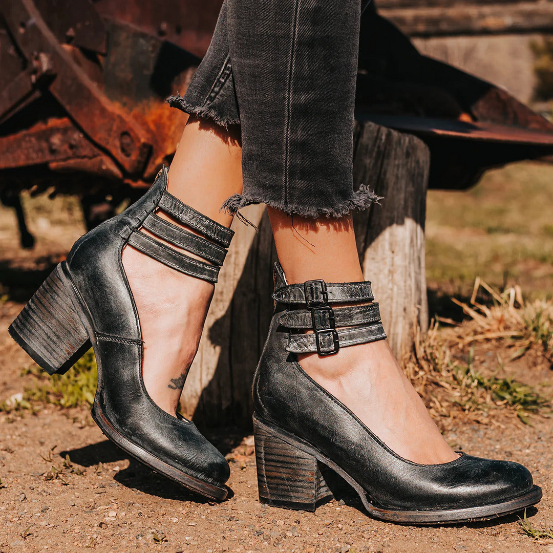 Black ankle strap sandals with stacked block heel and double buckle closure
