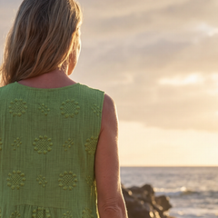 Green sleeveless midi dress, back view with floral embroidery pattern on shoulders