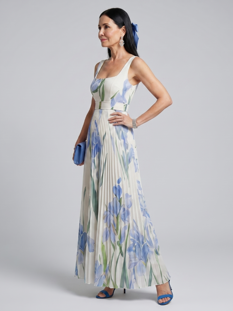 White sleeveless square-neck midi dress with blue flower and green leaf print