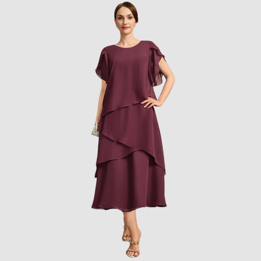 Burgundy chiffon midi dress with asymmetrical tiered layers and draped cape sleeves