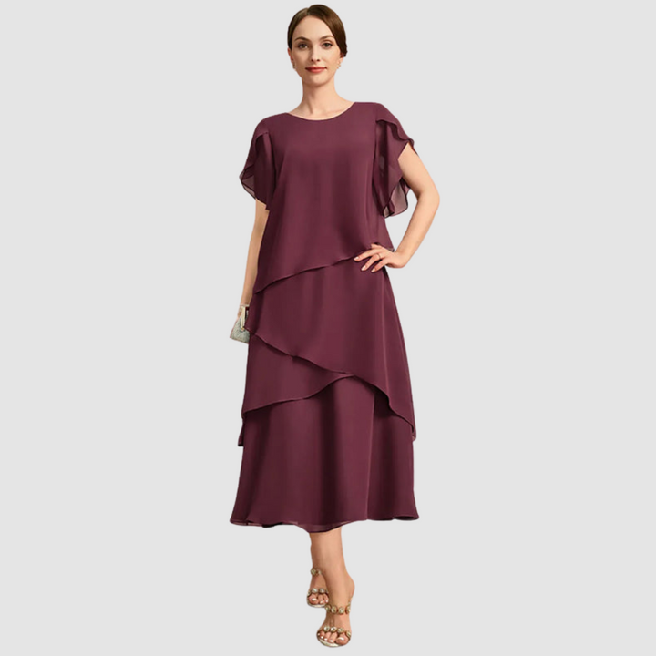 Burgundy chiffon midi dress with asymmetrical tiered layers and draped cape sleeves