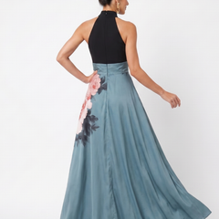 Back view of halter maxi dress: black top and teal skirt with pink floral panel