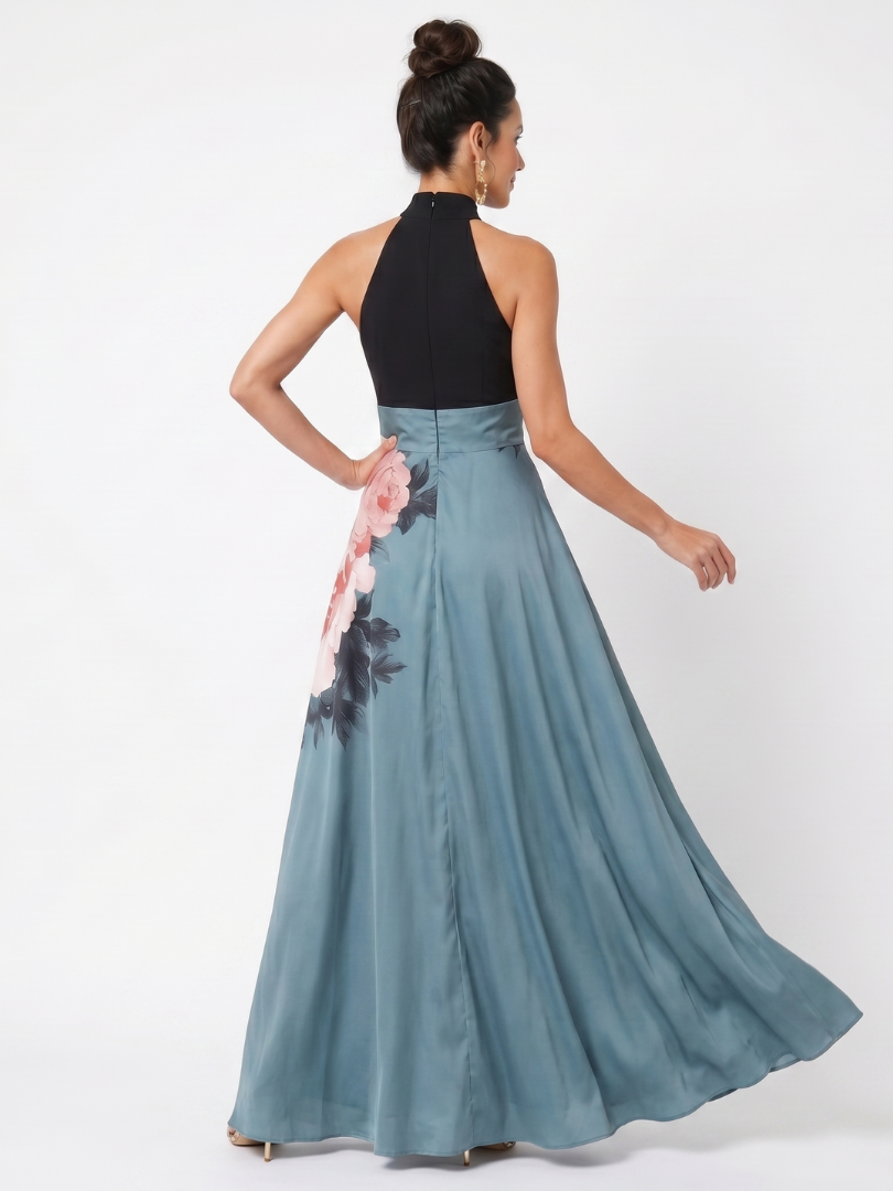 Back view of halter maxi dress: black top and teal skirt with pink floral panel