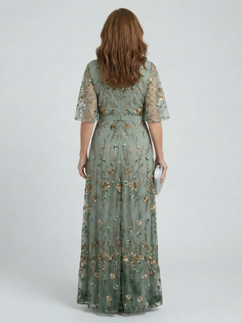 Sage green floral maxi dress with halter back, short sleeves and tiered skirt