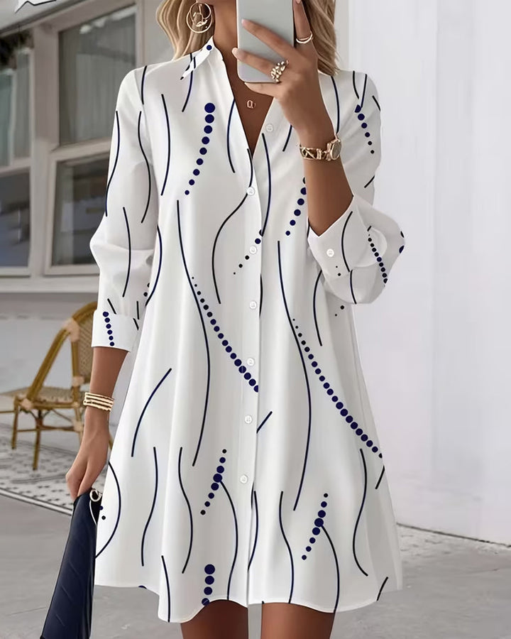 Women's white button-up wavy-collar shirt with navy wavy lines and scattered blue dots