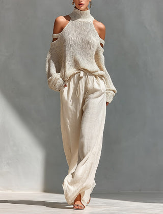 Beige cold-shoulder knit turtleneck top with matching drawstring trousers