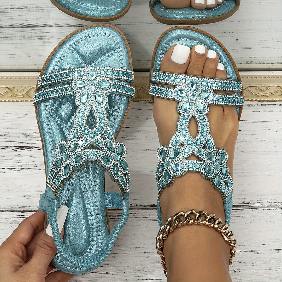Turquoise metallic boho sandals with rhinestone floral T-strap and toe ring detail