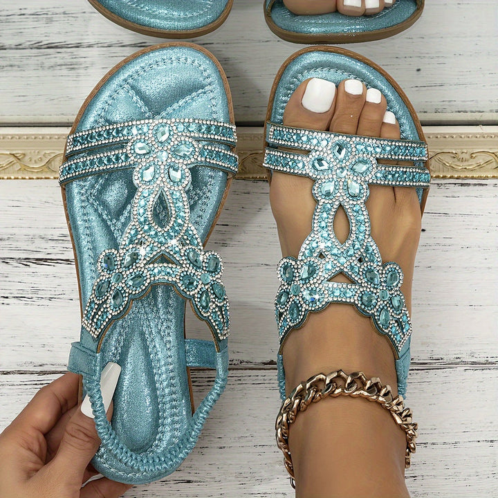 Turquoise metallic boho sandals with rhinestone floral T-strap and toe ring detail