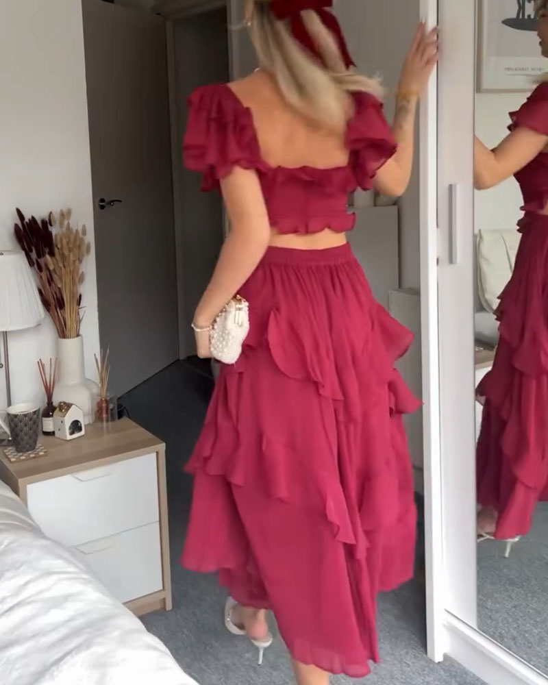 Magenta ruffle midi dress with off-shoulder neckline, layered tiers, and puff sleeves