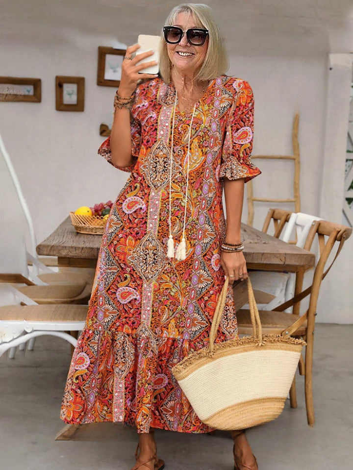Orange-red paisley Boho Grace dress, short puff sleeves, tassel-tie neckline