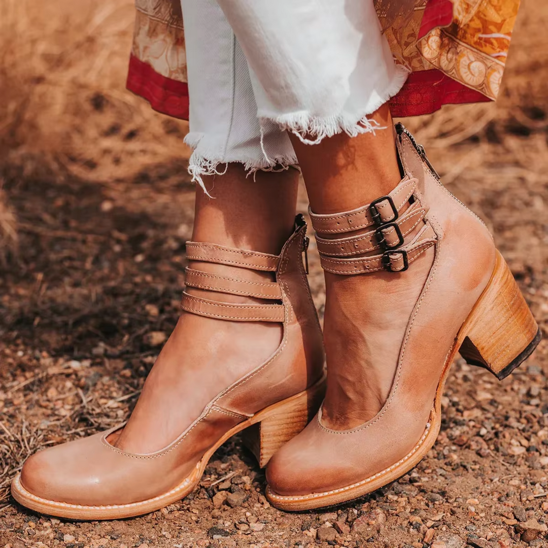 Tan heeled ankle boots with strap buckles and stacked block heel