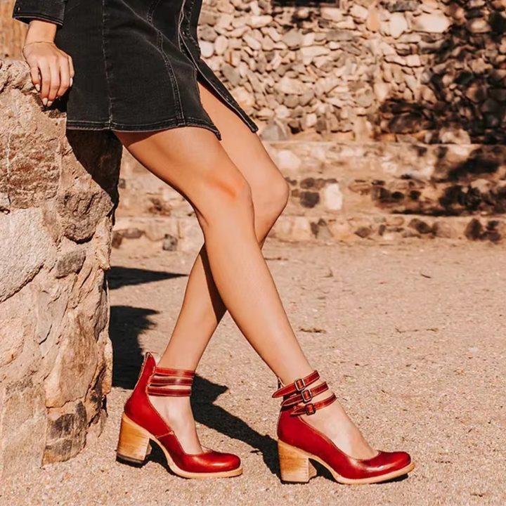 Red ankle heeled sandals with T-strap design and buckle closure