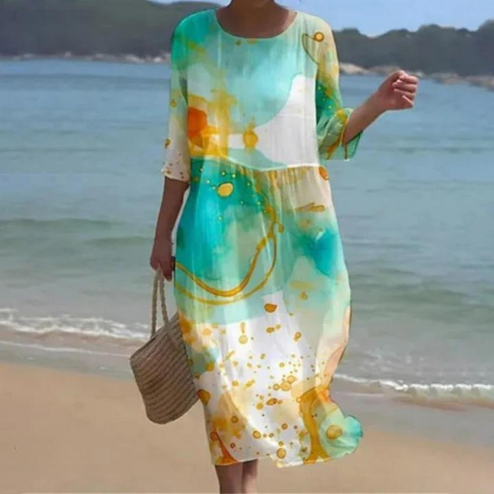 Knee-length short-sleeve dress with round neck, green and gold abstract print with dots