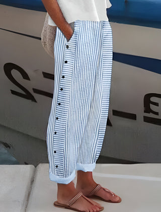 Blue-and-white striped trousers with button-front detail, wide leg