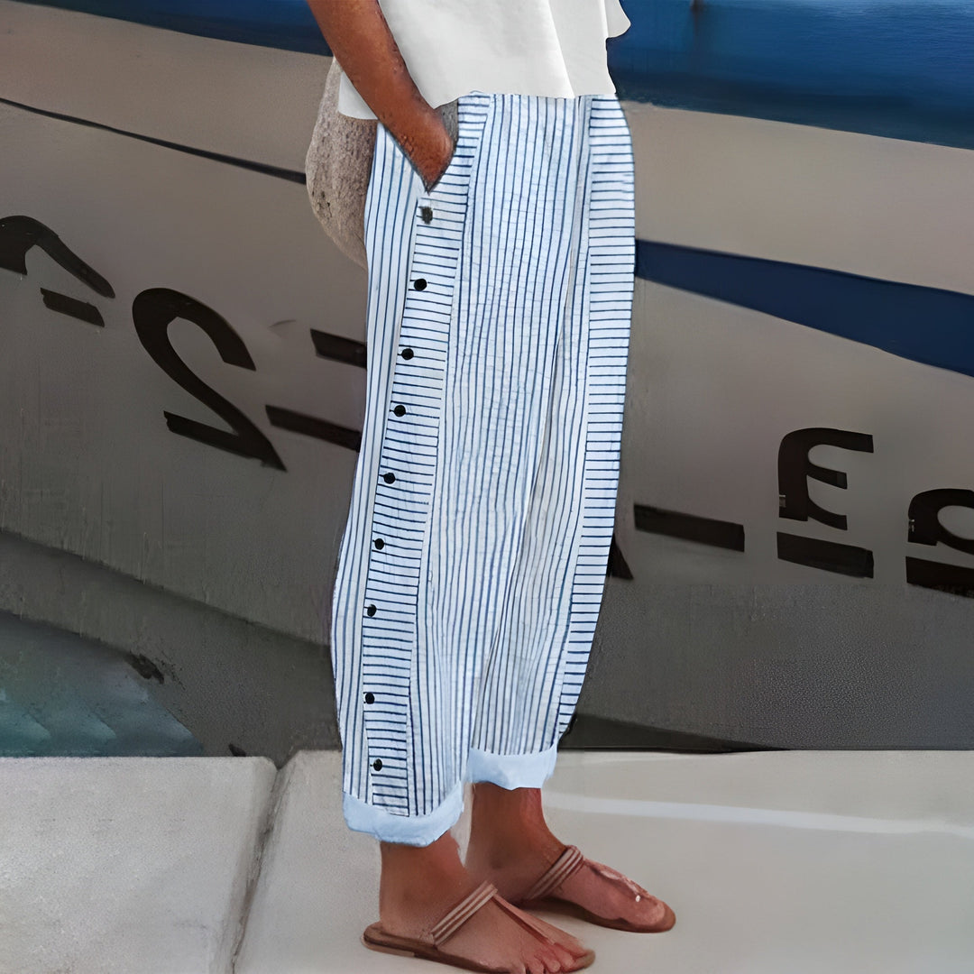 Blue-and-white striped trousers with button-front detail, wide leg