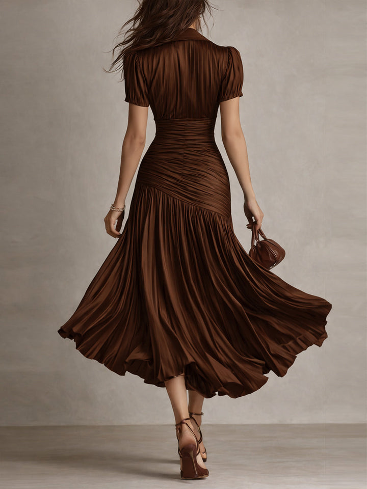 Dark brown ruched midi dress, back view, short sleeves and flared pleated skirt