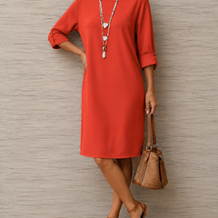 Red midi dress with round neckline and 3/4 sleeves, relaxed fit with side drape