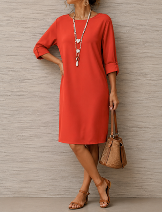 Red midi dress with round neckline and 3/4 sleeves, relaxed fit with side drape