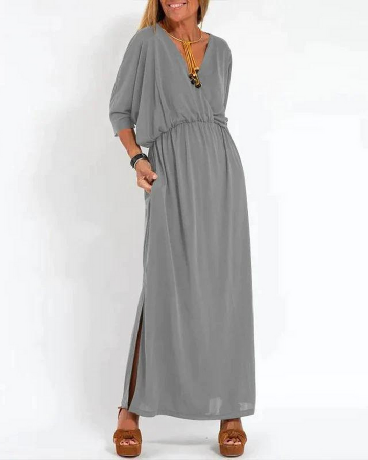 Gray bohemian summer dress with V-neck, elastic waist, and long flowy maxi skirt