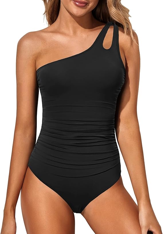 Black one-shoulder bathing suit front with ruched panel and cutout strap