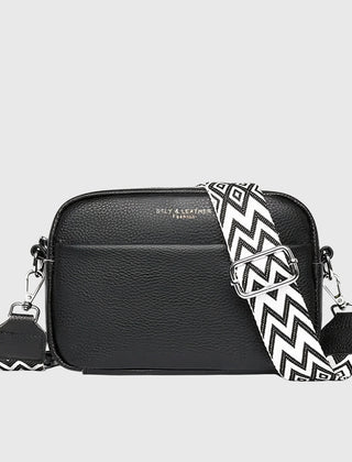 Black leather shoulder bag with chevron strap and two side zip pull charms