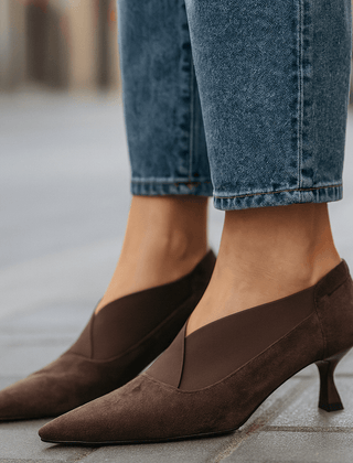 Dark brown suede pointed-toe heeled pumps with slim heel and slip-on design