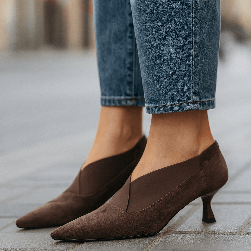 Dark brown suede pointed-toe heeled pumps with slim heel and slip-on design