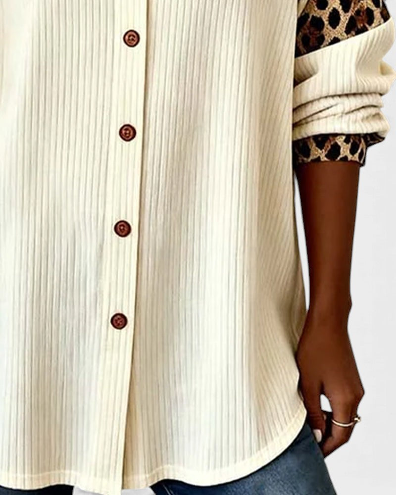 Off-white button-down shirt with vertical ribbed texture and button placket