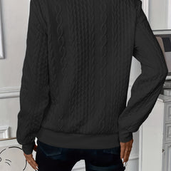 Black zip-up cable knit sweater, back view with textured pattern and ribbed cuffs
