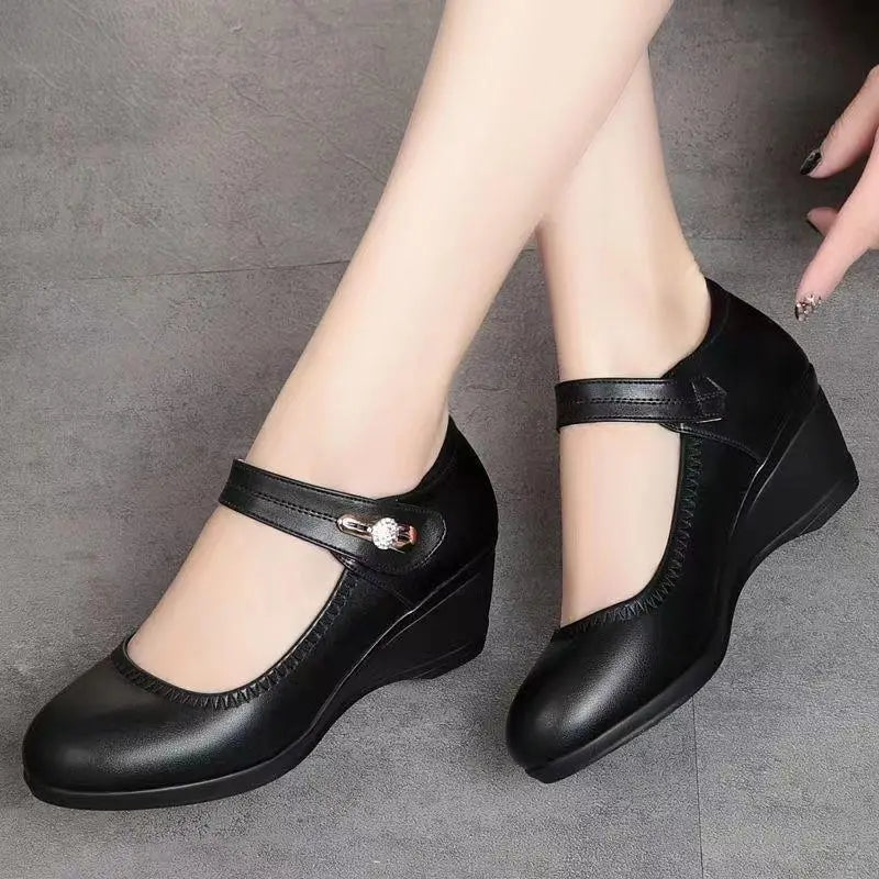 Black mid-heel Mary Jane comfort shoes with T-strap and decorative buckle