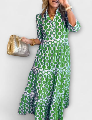 Green chain-print midi dress with short sleeves and tiered skirt