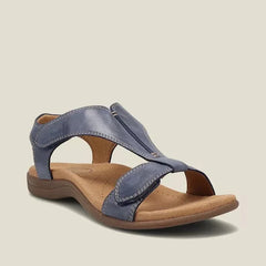 Blue orthopedic sandals with wide cross strap and low rubbery sole