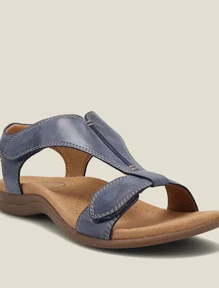 Blue orthopedic sandals with wide cross strap and low rubbery sole