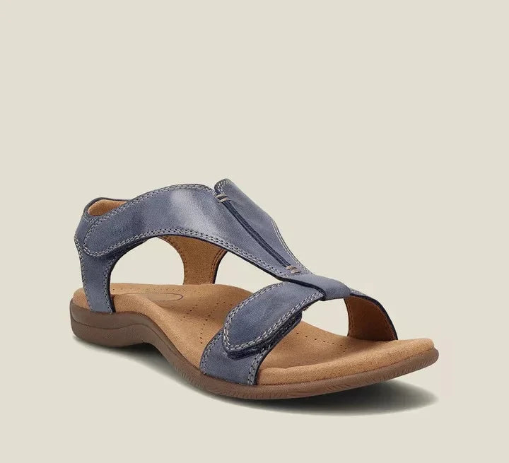 Blue orthopedic sandals with wide cross strap and low rubbery sole