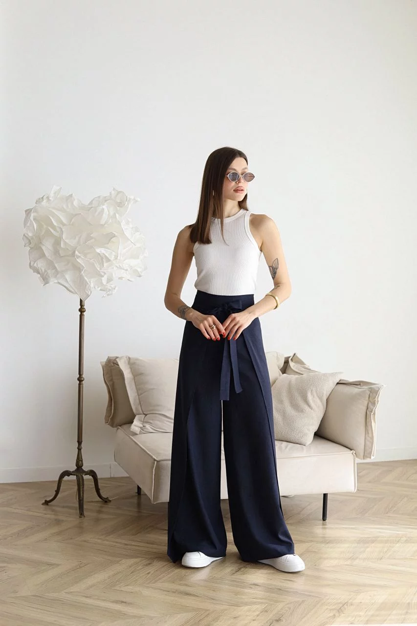 Navy high-waist wide-leg trousers with front tie sash and relaxed drape