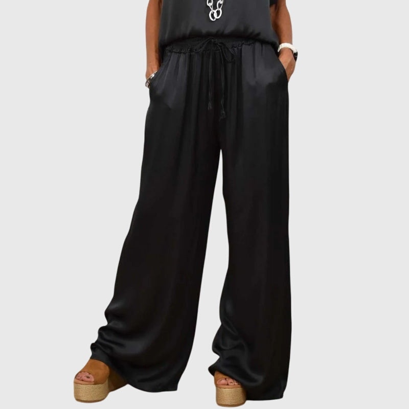 Black satin wide-leg pants with drawstring waist from a two-piece set