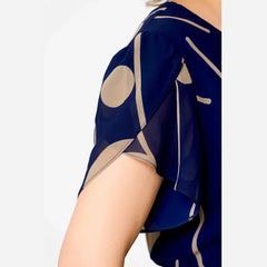 Navy chiffon dress sleeve with beige abstract polka dot pattern