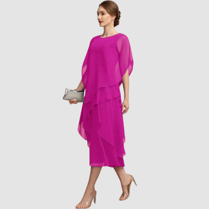 Fuchsia chiffon midi dress, back view, draped cape sleeves and cascading tiered hem