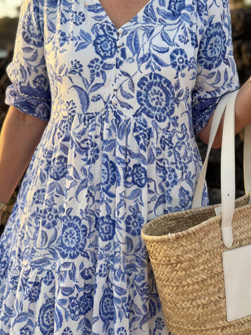 Blue floral V-neck midi dress with pleated tiers; 3/4 puff sleeves