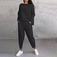 Black two-piece lounge set with long-sleeve sweatshirt and tapered ankle jogger pants