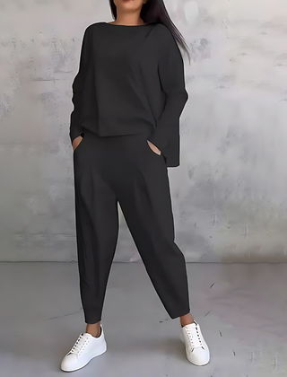 Black two-piece lounge set with long-sleeve sweatshirt and tapered ankle jogger pants
