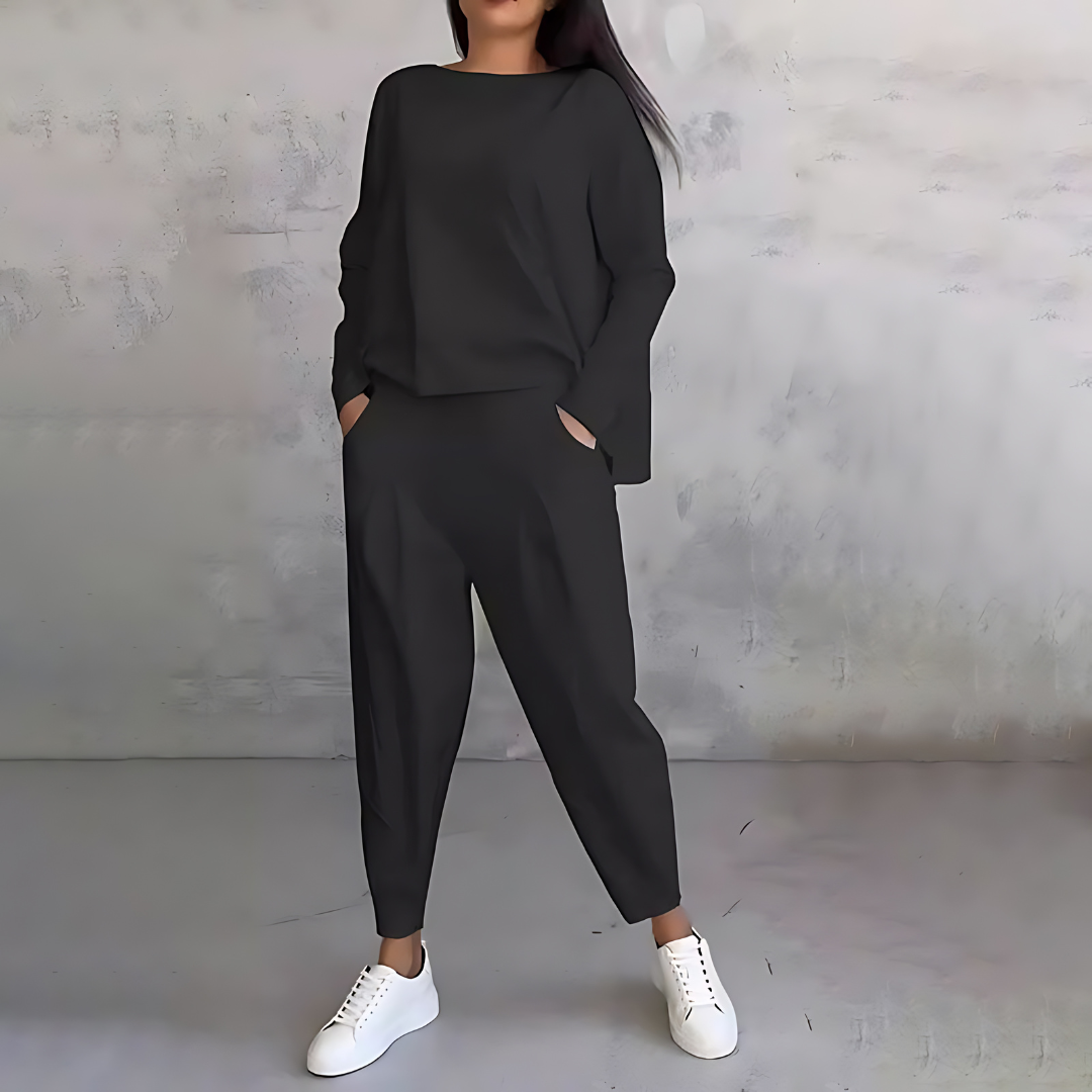 Black two-piece lounge set with long-sleeve sweatshirt and tapered ankle jogger pants