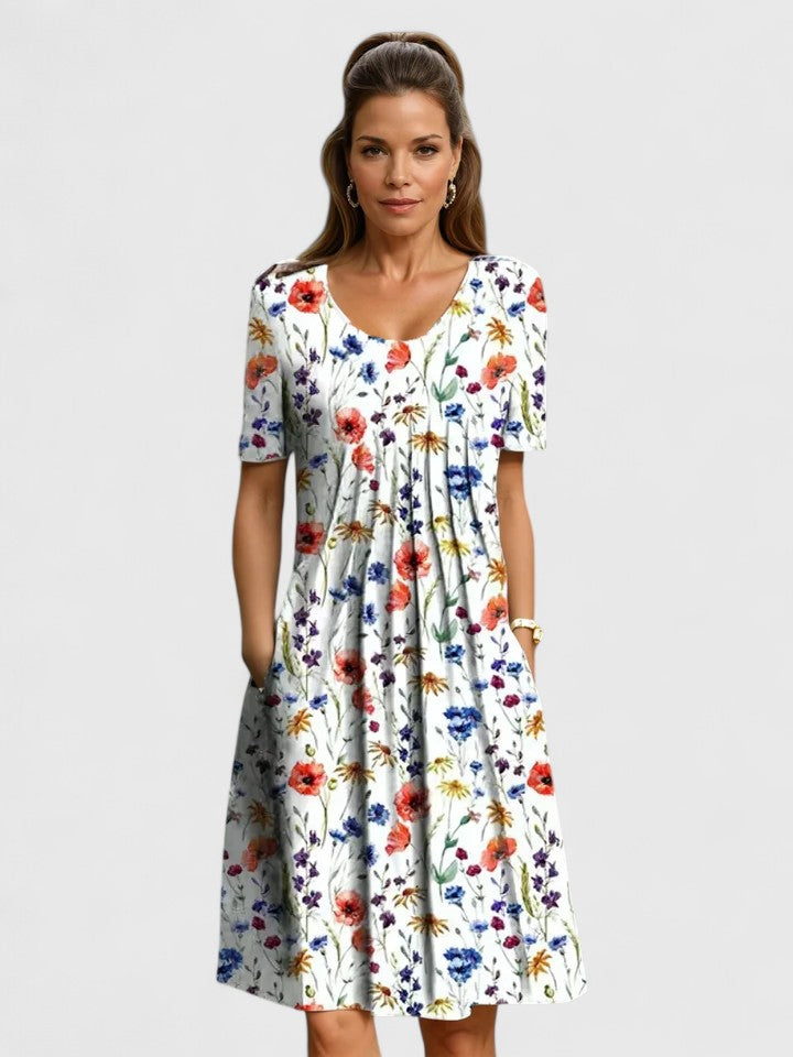 White floral midi dress with short sleeves and gathered skirt