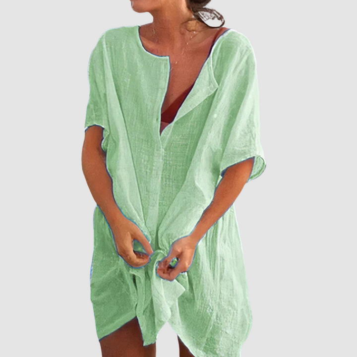 Green soft loose fit dress with V-neck, short sleeves, and front tie knot.