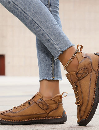 Orthopedic comfort sneaker in tan-brown with lace-up and ankle strap closure.