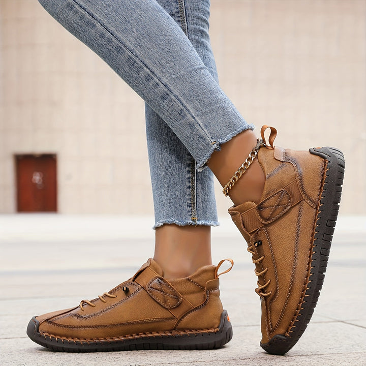 Orthopedic comfort sneaker in tan-brown with lace-up and ankle strap closure.