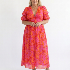 Pink floral V-neck midi dress with puff sleeves and gathered waist, full length