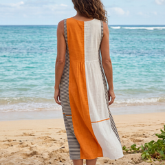 Back view of color-block striped midi dress with orange panel and striped side hem